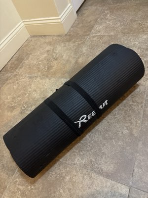 Reehut foam exercise mat, thick, rolled with a strap