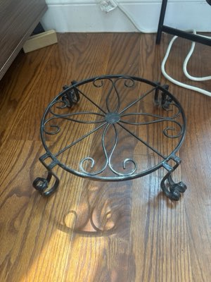Round plant pot stand, wrought iron with scrolled feet