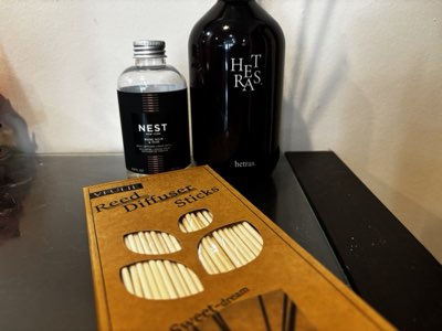 Reed diffuser and a NEST fragrance bottle