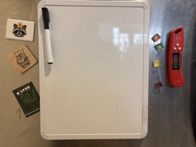 Fridge door: whiteboard, thermometer and magnets
