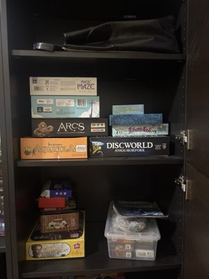 Magic: the Gathering cards in a clear storage box