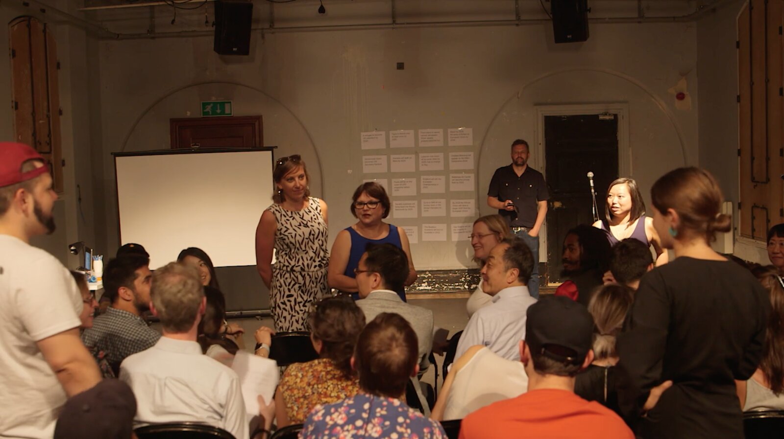 Audience standing and seated during Tassos Stevens's participatory game Ten